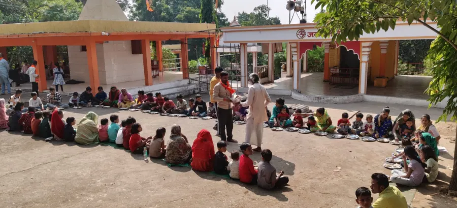 Community meal service at the temple courtyard